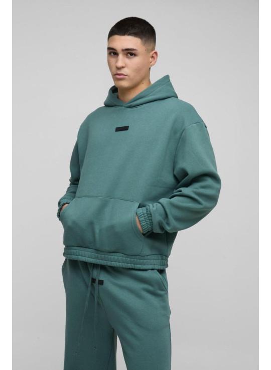 Величезний спортивний костюм з капюшоном і гумовим бейджем