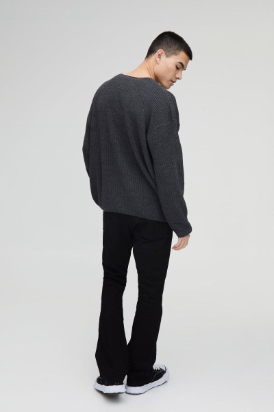 Величезний трикотажний джемпер із запущеними плечима в рубчик із V-подібним вирізом