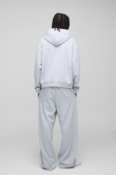 Величезний спортивний костюм із широкими штанинами та гумовим значком із капюшоном